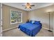 Bedroom featuring a ceiling fan, a sunny window, and bright blue comforter at 345 Kinsman Ct, Fuquay Varina, NC 27526