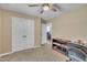 Bedroom features include neutral walls, carpeted floors, a ceiling fan, and a closet at 345 Kinsman Ct, Fuquay Varina, NC 27526