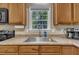 Close-up of a kitchen counter with a stainless steel sink and modern fixtures at 345 Kinsman Ct, Fuquay Varina, NC 27526
