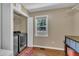 Spacious laundry room with modern washer and dryer, shelving, and natural light at 345 Kinsman Ct, Fuquay Varina, NC 27526