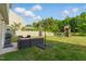 A spacious backyard featuring a patio set, playground, and lush green lawn perfect for outdoor enjoyment at 4108 Lady Slipper Ln, Durham, NC 27704