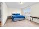 Bedroom features a blue bed set and neutral carpet with a light colored wall at 4108 Lady Slipper Ln, Durham, NC 27704