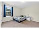 Bright bedroom with a comfortable bed and a view of the outside, perfect for relaxation at 4108 Lady Slipper Ln, Durham, NC 27704