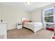 Bright bedroom featuring carpet flooring and a window providing natural light at 4108 Lady Slipper Ln, Durham, NC 27704