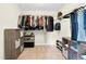Spacious walk-in closet with adjustable shelving and ample storage for clothes and accessories at 4108 Lady Slipper Ln, Durham, NC 27704