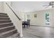 Open dining area featuring a modern light fixture, table and chairs, and convenient access to backyard at 4108 Lady Slipper Ln, Durham, NC 27704