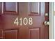 Close-up of front door with the house number displayed, showcasing a welcoming entryway at 4108 Lady Slipper Ln, Durham, NC 27704