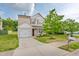 Lovely two-story home featuring a clean driveway, well-maintained lawn, and inviting curb appeal at 4108 Lady Slipper Ln, Durham, NC 27704