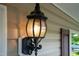 Close up of an outdoor lamp fixture, highlighting the home's exterior lighting at 4108 Lady Slipper Ln, Durham, NC 27704