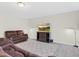 Spacious living room features a large sofa, media center with television, and modern flooring at 4108 Lady Slipper Ln, Durham, NC 27704