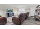 Cozy living room with comfortable leather seating, entertainment center, and neutral decor at 4108 Lady Slipper Ln, Durham, NC 27704