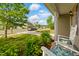 Relaxing front porch view with rocking chairs, manicured bushes, and a glimpse of a friendly neighborhood at 4108 Lady Slipper Ln, Durham, NC 27704