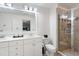 Elegant bathroom with a double vanity, marble countertops, and glass-enclosed shower at 429 Marsh Landing Dr, Holly Springs, NC 27540