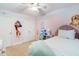 Charming bedroom featuring pink walls, white trim, a bed and a night stand at 429 Marsh Landing Dr, Holly Springs, NC 27540