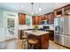 Beautiful kitchen with stainless steel appliances, granite countertops, and a center island with seating at 429 Marsh Landing Dr, Holly Springs, NC 27540