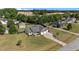 Expansive aerial view of home, featuring a spacious yard, outbuilding, and multi-car driveway at 45 Hawley Ridge Dr, Dunn, NC 28334