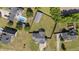 Aerial view of the property showing its layout, pool, outbuilding, and fenced backyard at 45 Hawley Ridge Dr, Dunn, NC 28334