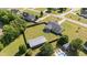 Large backyard features a fenced in area, outbuilding, and a pool, as seen from above at 45 Hawley Ridge Dr, Dunn, NC 28334