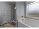 Bathroom showing large tub, shower, and window at 45 Hawley Ridge Dr, Dunn, NC 28334