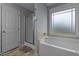Bathroom showing large tub, shower, and window at 45 Hawley Ridge Dr, Dunn, NC 28334