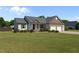 Charming single-story home with well-maintained landscaping and a two car garage at 45 Hawley Ridge Dr, Dunn, NC 28334