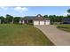 Well-maintained home with a multi-car garage, beautiful stone accents, and a spacious front yard at 45 Hawley Ridge Dr, Dunn, NC 28334