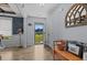 Inviting foyer with wood-look floors, a bench, and a view of the front yard through the glass-paneled front door at 45 Hawley Ridge Dr, Dunn, NC 28334