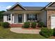 Charming front porch with rocking chairs, fresh landscaping, and inviting entryway at 45 Hawley Ridge Dr, Dunn, NC 28334