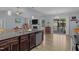 Spacious kitchen featuring granite counters, stainless steel appliances, and natural light from the sliding door at 45 Hawley Ridge Dr, Dunn, NC 28334