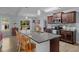 Modern kitchen with granite countertops, tile backsplash, stainless steel appliances, and wood cabinets at 45 Hawley Ridge Dr, Dunn, NC 28334