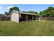 Image showing the backyard shed with ample storage space and an American flag at 45 Hawley Ridge Dr, Dunn, NC 28334