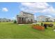 Spacious backyard featuring a deck, patio, and fire pit area, ideal for outdoor gatherings at 4504 Beckel Rd, Willow Springs, NC 27592