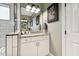 Stylish bathroom with white cabinets, granite countertop, decorative art, and a view of a subway-tiled shower at 4504 Beckel Rd, Willow Springs, NC 27592