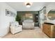 Charming Bedroom features neutral tones, stylish decor, including a crib, dresser, chair, and a themed 'Logan' wall sign at 4504 Beckel Rd, Willow Springs, NC 27592