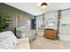 Inviting Bedroom showcasing a crib, dresser, and chair near a window, highlighted by stylish decor and neutral tones at 4504 Beckel Rd, Willow Springs, NC 27592