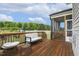 Spacious wooden deck with outdoor seating, perfect for entertaining or enjoying serene backyard views at 4504 Beckel Rd, Willow Springs, NC 27592