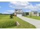 Charming two-story home with stone accents, two-car garage, and expansive yard at 4504 Beckel Rd, Willow Springs, NC 27592