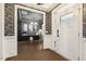 Elegant foyer with hardwood floors, wainscoting and views into the office at 4504 Beckel Rd, Willow Springs, NC 27592