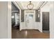 Elegant foyer with hardwood floors, wainscoting and views into the main living area at 4504 Beckel Rd, Willow Springs, NC 27592