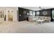 This living room features a large sectional, a TV, and access to the Primary bath and other rooms at 4504 Beckel Rd, Willow Springs, NC 27592