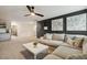 Large sectional in the open-concept living room features access to the upstairs and lots of seating at 4504 Beckel Rd, Willow Springs, NC 27592