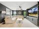 Open-concept living room featuring a large sectional, TV, and windows for lots of natural light at 4504 Beckel Rd, Willow Springs, NC 27592
