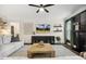 Comfortable living room features stylish decor, ceiling fan, and a large window at 4504 Beckel Rd, Willow Springs, NC 27592