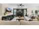 Cozy living room featuring a fireplace, comfortable seating, and natural light at 4504 Beckel Rd, Willow Springs, NC 27592