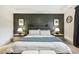 Well-lit main bedroom featuring a dark accent wall and coordinated bedside tables at 4504 Beckel Rd, Willow Springs, NC 27592