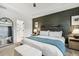 Main bedroom showcasing dark accent wall and en-suite bathroom at 4504 Beckel Rd, Willow Springs, NC 27592