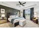Spacious main bedroom with a decorative accent wall, tray ceiling, and view to the yard at 4504 Beckel Rd, Willow Springs, NC 27592