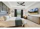 Bright main bedroom featuring high tray ceilings, a TV, and a large window at 4504 Beckel Rd, Willow Springs, NC 27592