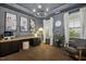 Modern office with custom built-ins, wood floors and wainscoting at 4504 Beckel Rd, Willow Springs, NC 27592