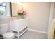 Bathroom featuring a white vanity, tile flooring, and a framed mirror at 5013 Brassfield Dr, Rocky Mount, NC 27803